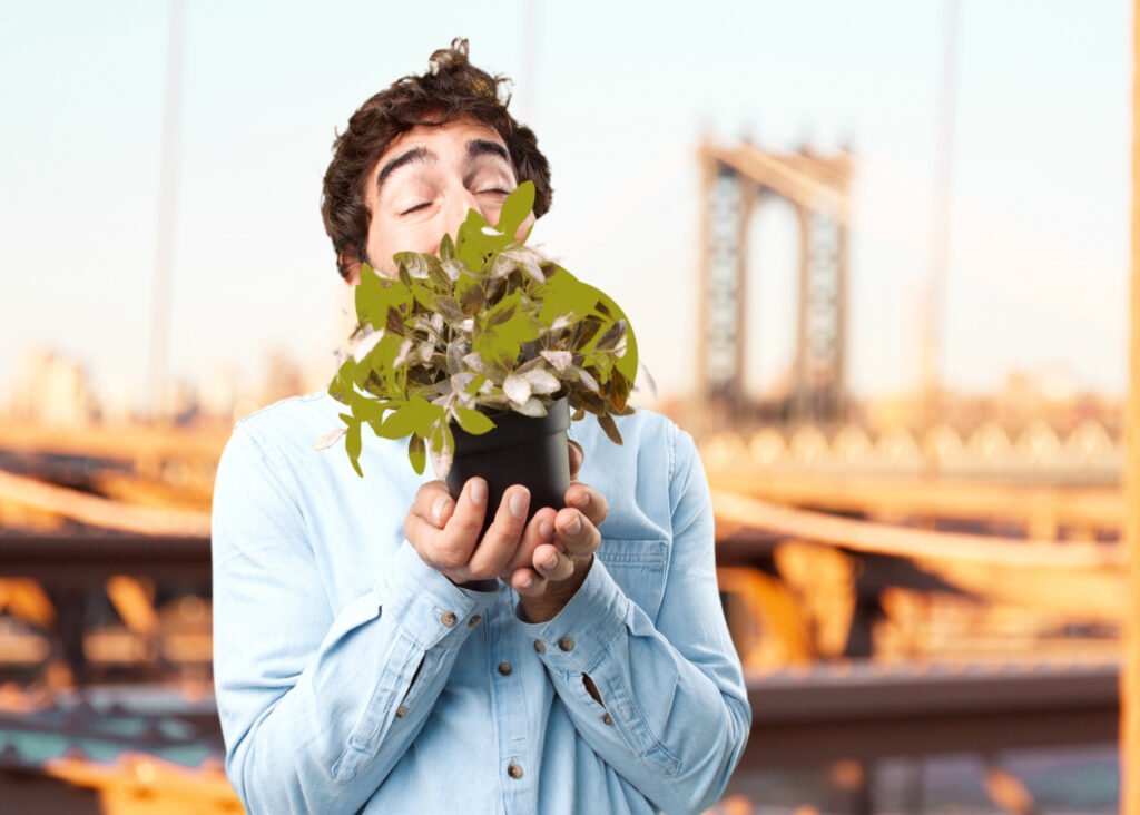Young man smiling happily, representing habits and lifestyle choices that boost mood naturally.